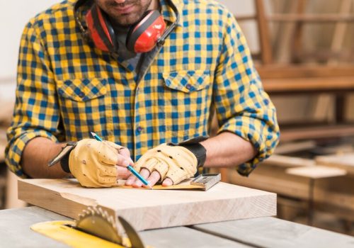 close-up-male-carpenter-working-workshop_23-2147944847