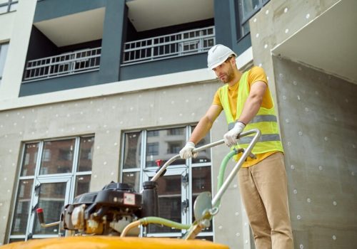 effort-fatigue-young-adult-tired-man-protective-helmet-bright-vest-with-special-equipment-working-construction-site-against-background-new-building_259150-57671