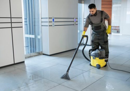 full-shot-man-vacuuming-office-floor_23-2149345550